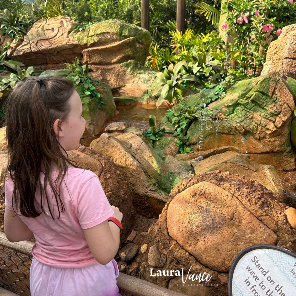 girl explores Journey of Water at EPCOT while staying cool at disney world