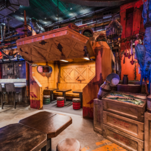 Interior of Docking Bay 7 Food and Cargo at Star Wars: Galaxy’s Edge, featuring themed décor and indoor seating that resembles a cargo hangar on the planet Batuu.